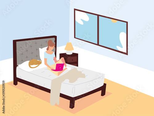woman sitting on bed with laptop and working remotely at home