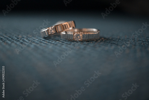 ring with diamonds on blue background macro photography