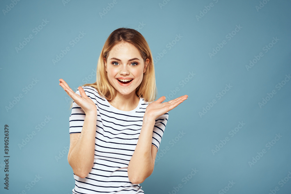 Pretty woman striped t-shirt fun emotions lifestyle blue background Pretty woman striped t-shirt fun emotions lifestyle blue background