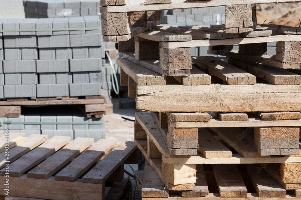 empty wooden pallets and new construction tiles empty wooden pallets and new construction tiles