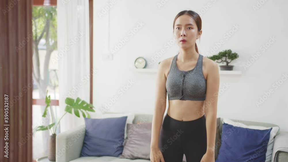 Young Asian healthy woman workout at home, exercise, fit, doing yoga, home fitness concept Young Asian healthy woman workout at home, exercise, fit, doing yoga, home fitness concept