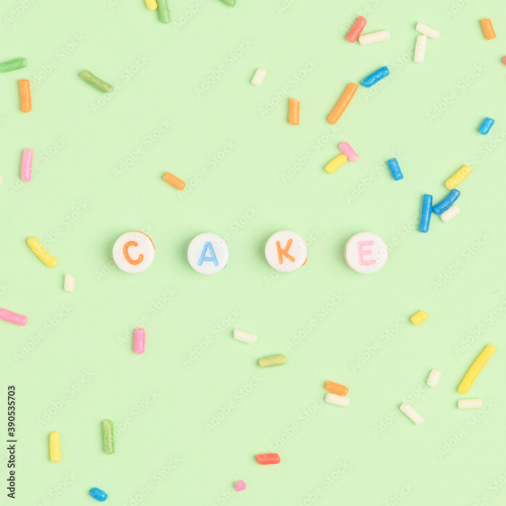 CAKE beads text typography on green CAKE beads text typography on green
