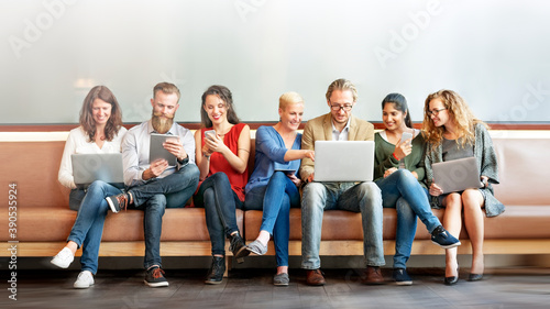 Diverse people using digital devices photo