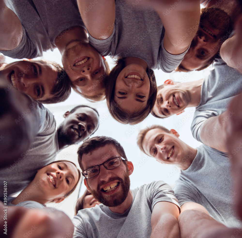 bottom view. group of successful young people looking at the cam