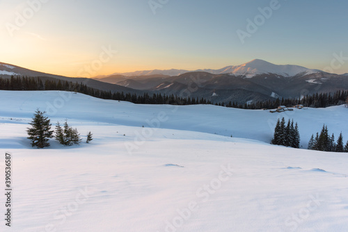 Snowy winter in the Ukrainian Carpathians and picturesque mountain houses © reme80