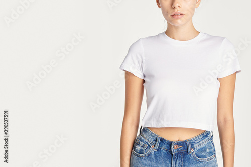 Fotografiet Women in a sexy white cropped top with design space