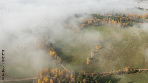 Obraz na płótnie Landscape with fog and hills on an epic autumn morning w salonie