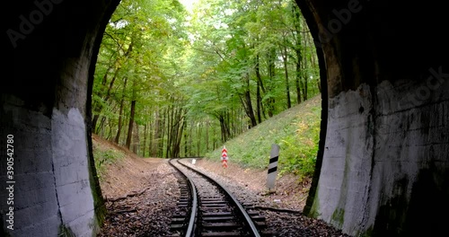 leaving a dark railway tunnel on foot