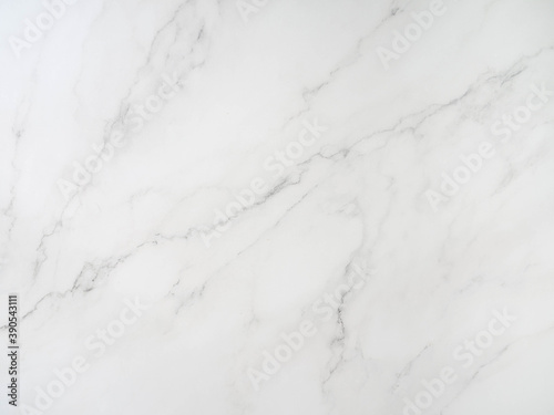 White marble pattern tile It shows detailed patterns and patterns of marble with a black pattern.
