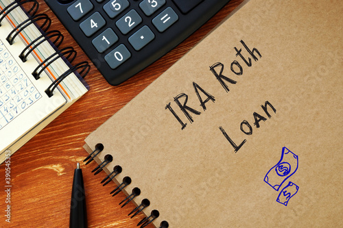 Business concept meaning IRA Roth Loan with sign on the sheet.