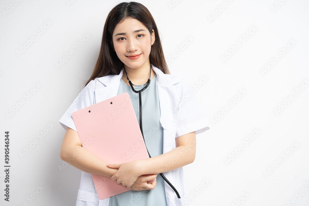 Portrait of female doctor holding document in hand
Portrait of female doctor holding document in hand
