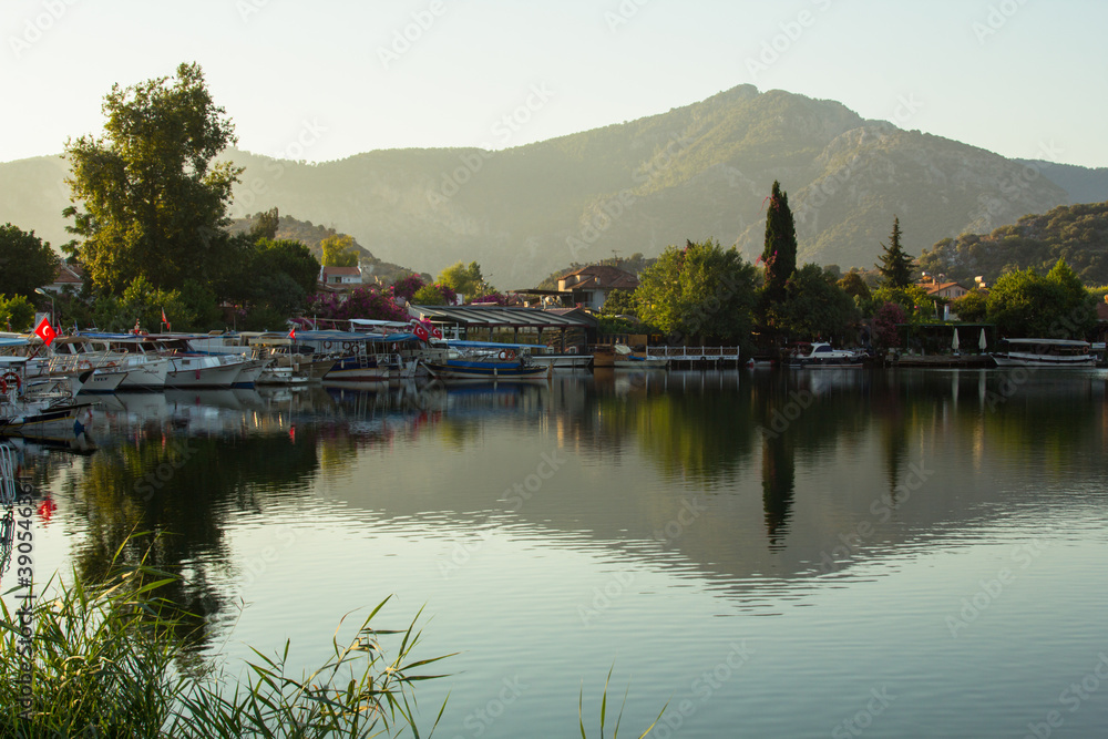 View of the river and boats at sunrise.