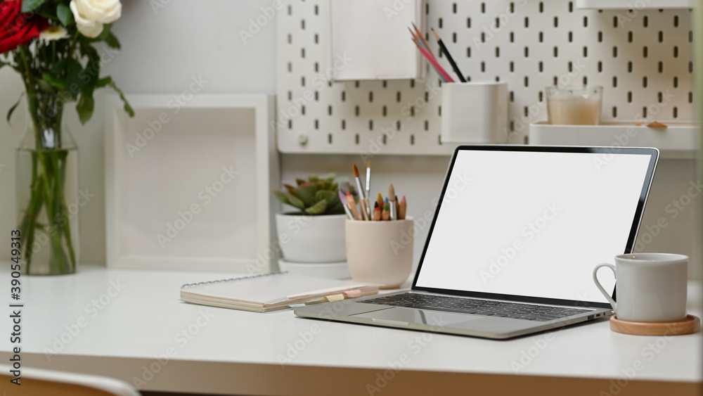 Fototapeta premium Workspace, laptop, supplies, decorations and copy space in home office, clipping path