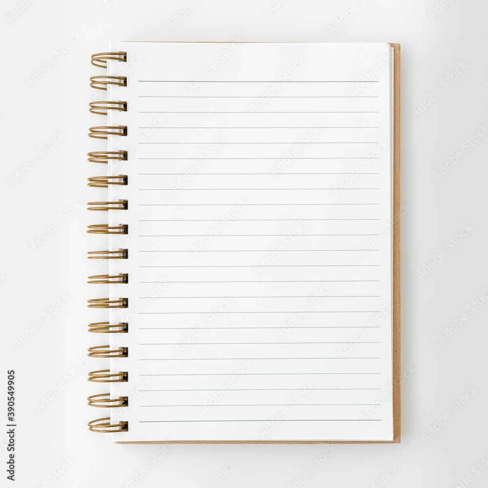 Blank ruled notebook on a white table Blank ruled notebook on a white table