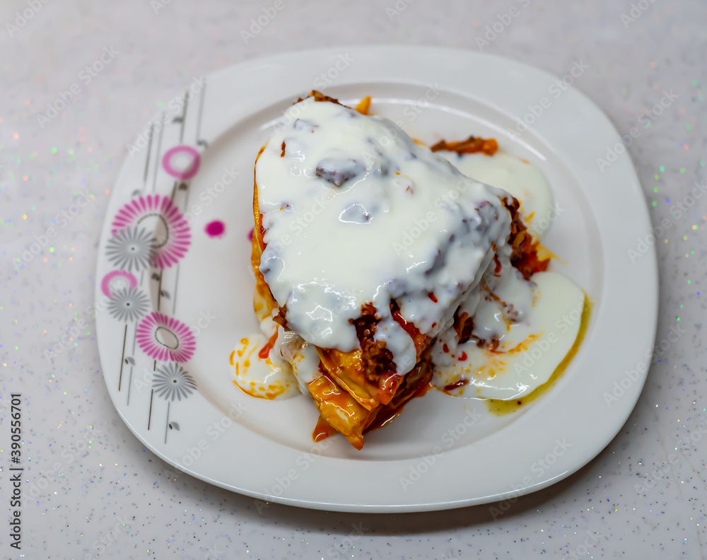 Traditional Turkish Food Kayseri Yalama with Minced Meat, Yogurt and Tomato Paste Stock Photo