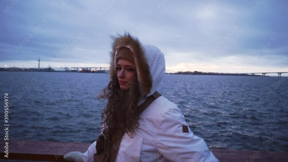 Norwegian Cloudy Sea. The girl is enjoying the view. Scandinavian Foggy seascape. Cloudy dramatic landscape. Blue time