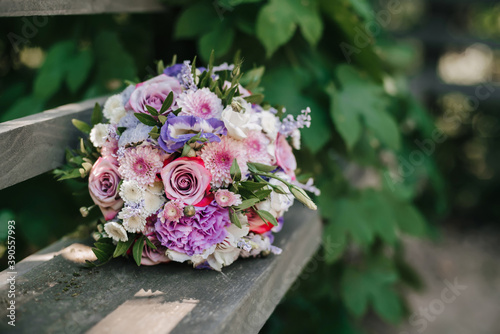 wedding bouquet of roses and pink chrysanthemums