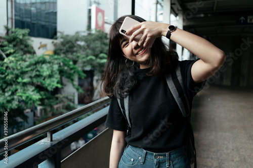 Good mood woman backpacker in Bangkok.