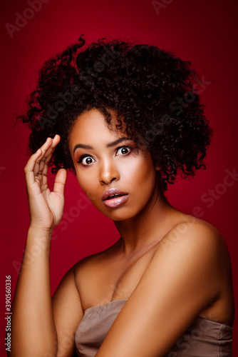 Emotional dark-skinned girl. Beautiful African American woman with a beautiful hairstyle