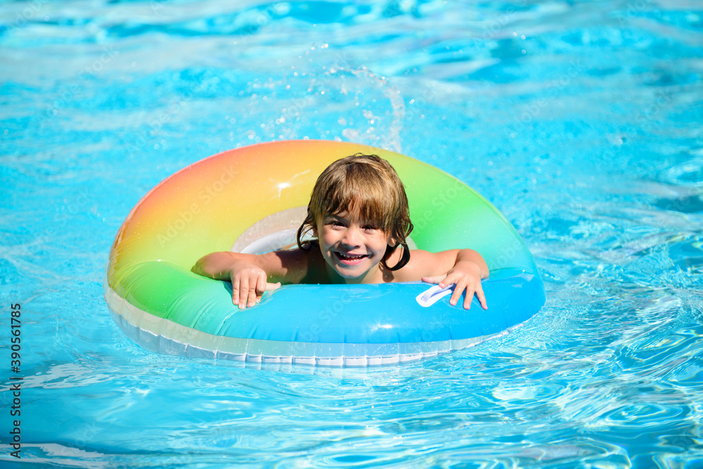 Child in swimming pool. Summer activity. Healthy kids lifestyle.