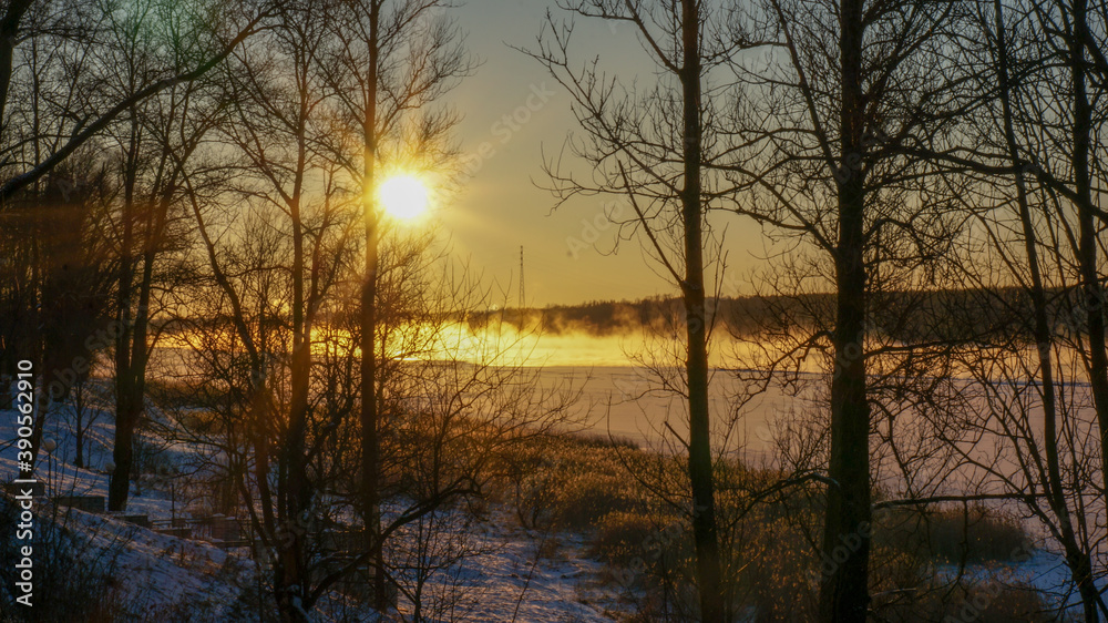frosty winter over the river, sunset