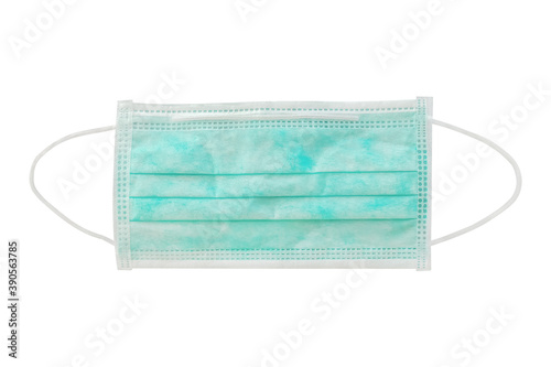 Green Surgical or medical mask with rubber ear straps. Procedure mask from virus and bacteria isolated on white with clipping path included.