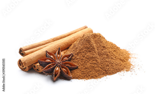 Cinnamon sticks, powder and anise on white background