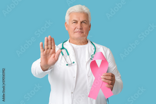 Doctor with pink ribbon on ...