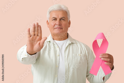 Mature man with pink ribbon...