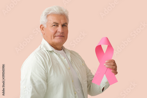 Mature man with pink ribbon...