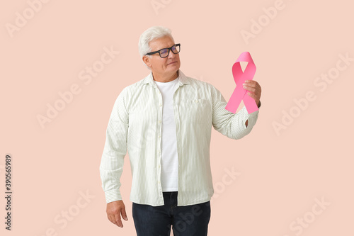 Mature man with pink ribbon...