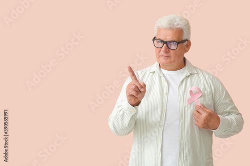 Mature man with pink ribbon...