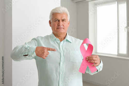 Mature man with pink ribbon...