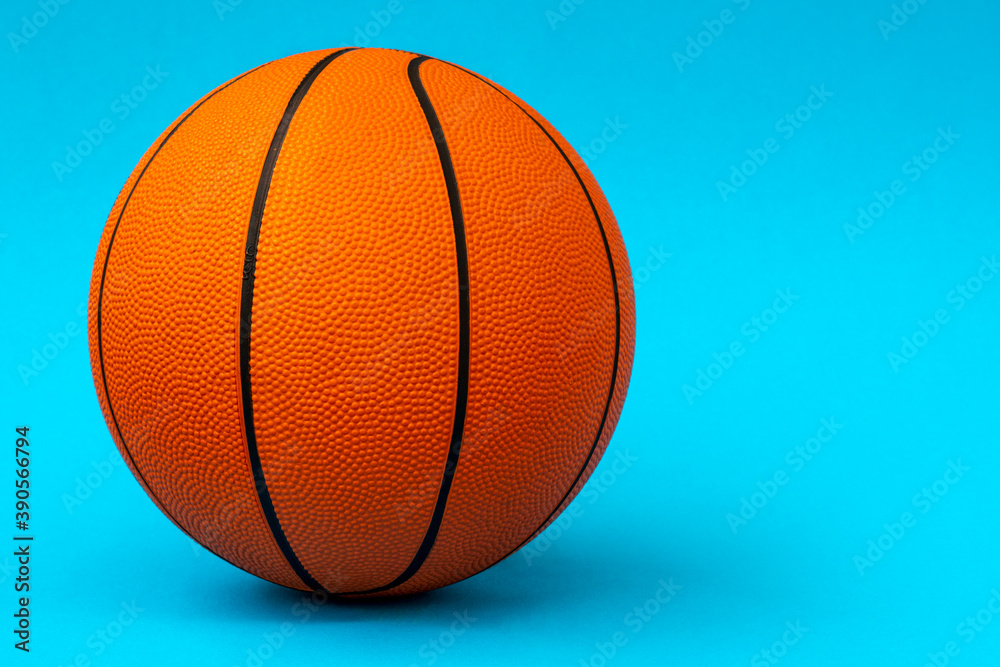 Orange basketball ball isolated on blue background