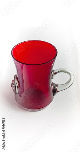 Glass red mug close up isolated on a white background