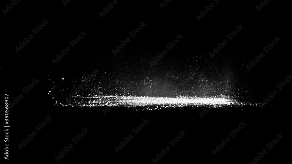 Blasting on ground, stone fragments and smoke exploded from right side flying out to the left