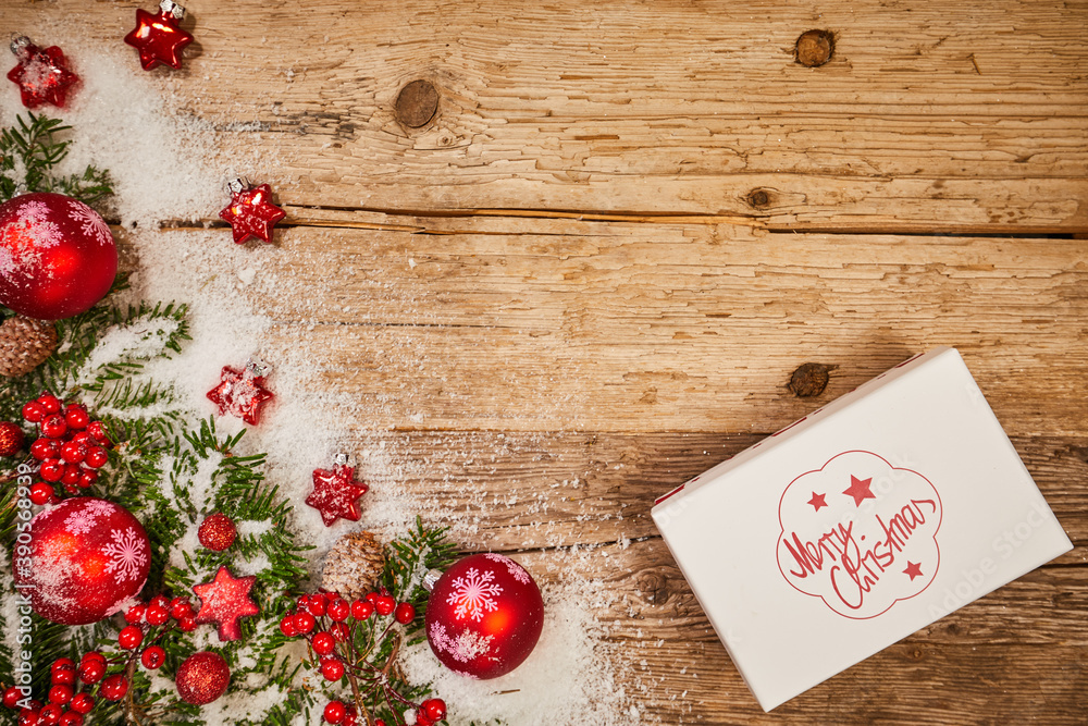 Christmas background with fir tree and decoration on dark wooden board Christmas background with fir tree and decoration on dark wooden board
