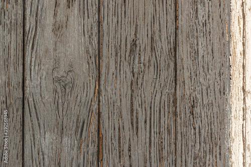 material texture of weathered wood boards with peeling gray paint