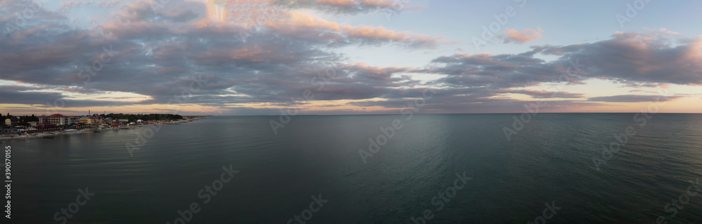 Morning panorama of the sea and the city on the coast. View from the sea