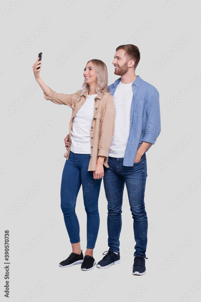 Fototapeta premium Couple Taking Selfie Isolated. Couple, Lovers, Family, Friends Concept