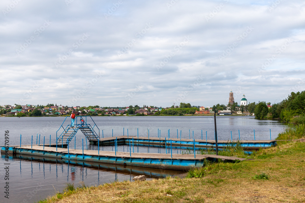 The beach, in the town Sysert Russia, the pontoons on the river.