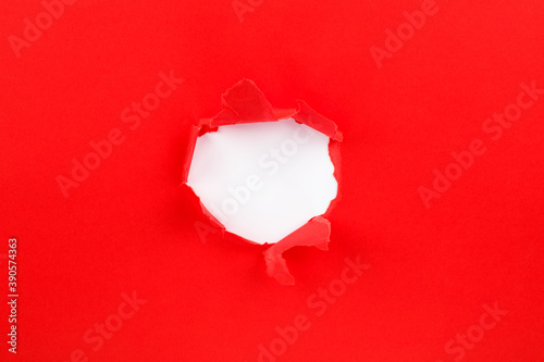 red Hole in the paper with torn sides. christmas background