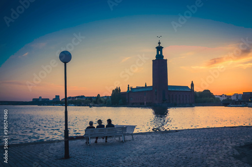 Watercolor drawing of Silhouette of women sitting on bench at promenade of Lake Malaren looking at Stockholm City Hall Stadshuset tower building on Kungsholmen Island at sunset, dusk sky, Sweden