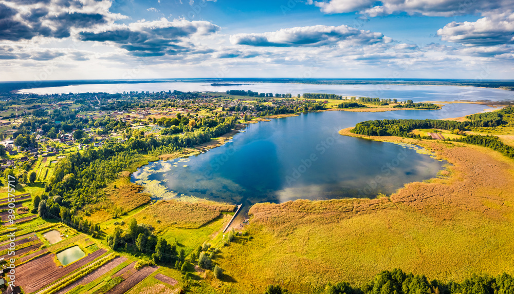 Perfect summer view from flying drone of Svityaz Lake, . Great morning scene of Shatsky National Park, Volyn region, Ukraine, Europe. Beauty of nature concept background.