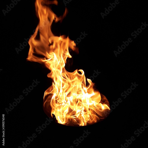 Fire flame on a BBQ tray. The flame comes out from burning coconut shells with oxygen. It makes stable heat. 