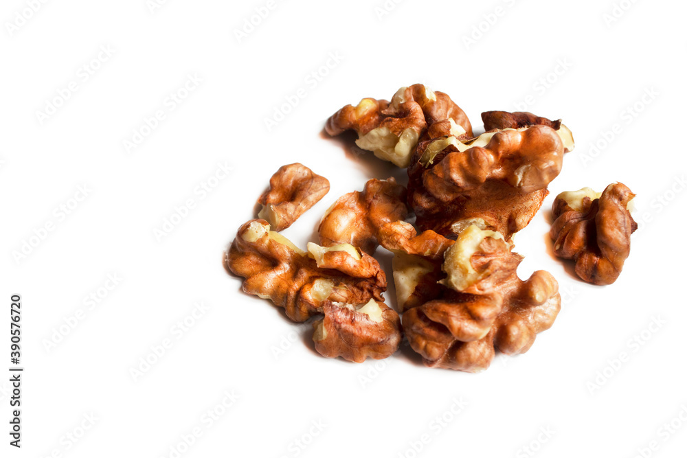 Group of chopped walnuts, peeled, pieces. Isolate on a white background. Health products. Source of magnesium, potassium, for heart health, memory will improve, antioxidants. Top view. Copy space. Group of chopped walnuts, peeled, pieces. Isolate on a white background. Health products. Source of magnesium, potassium, for heart health, memory will improve, antioxidants. Top view. Copy space.