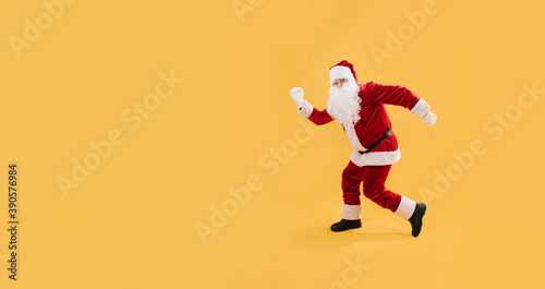 Santa Claus in a funny pose, studio shot. © zzzdim
