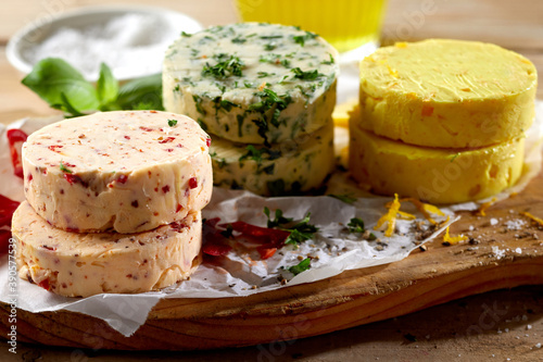 Assorted flavors of savory butter pats photo