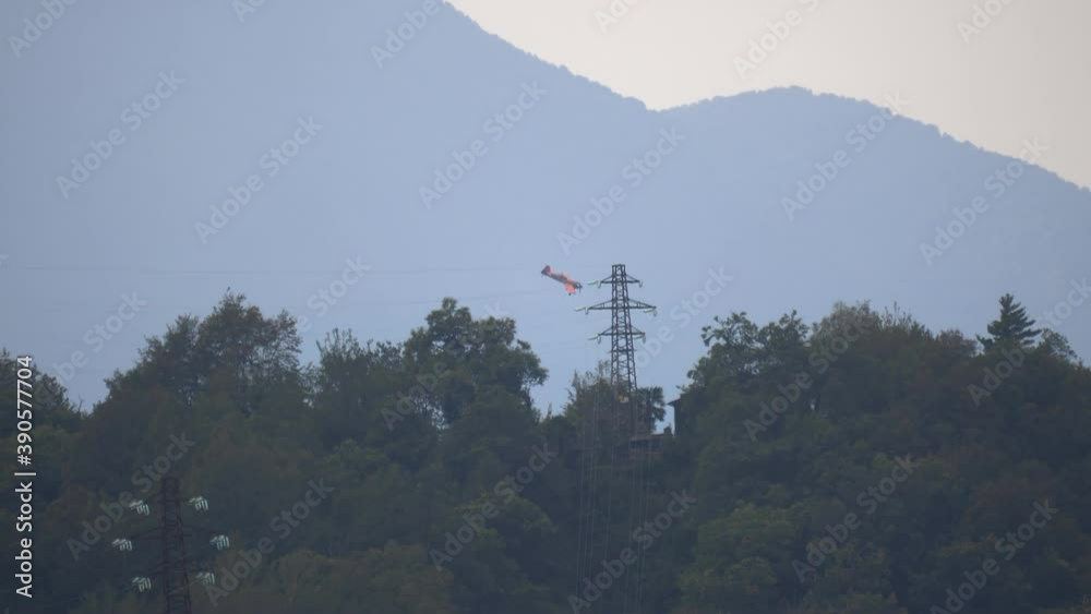 A small plane during an aerobatic simulation: plane engine failure, white smoke coming out from the engine as the plane crashes
