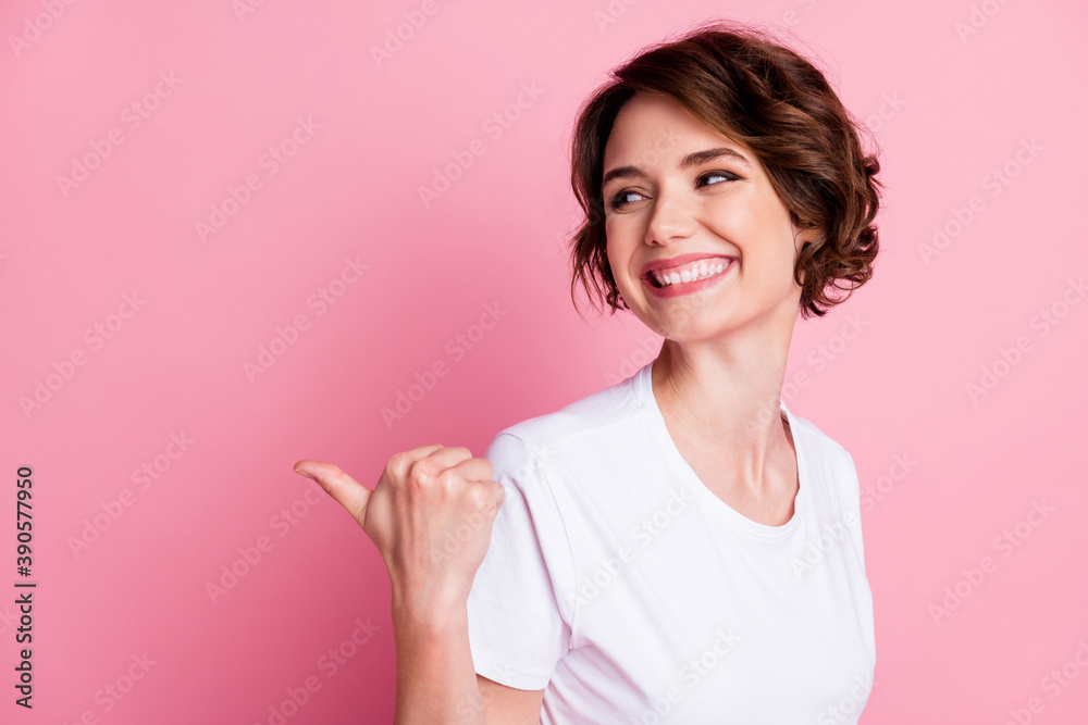 Close-up portrait of lovely cheerful cheery brown-haired girl showing thumb copy empty space isolated over pink pastel color background Close-up portrait of lovely cheerful cheery brown-haired girl showing thumb copy empty space isolated over pink pastel color background